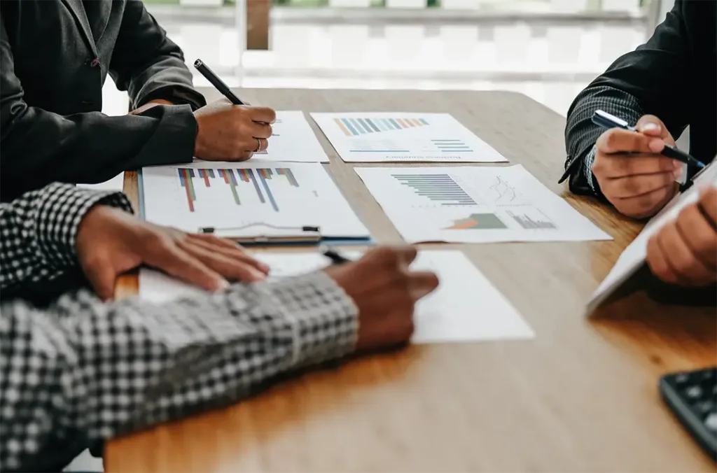 a group of people work to solve financial problems