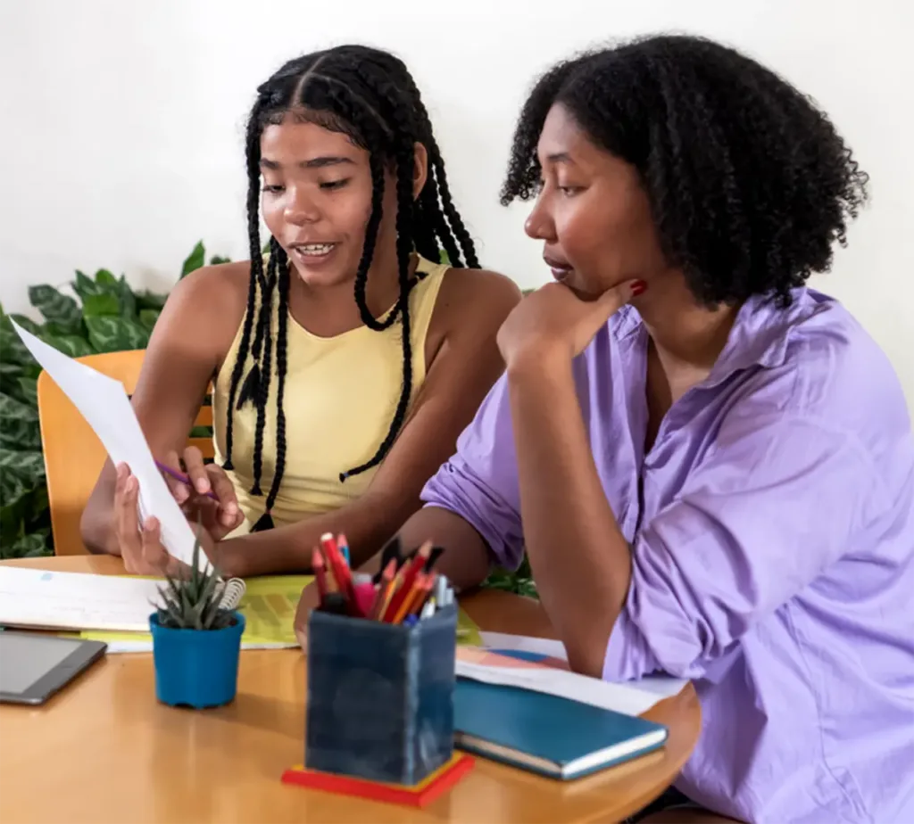 a woman and mentors a girl