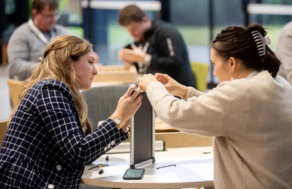 2 women assemble a solar powered kit