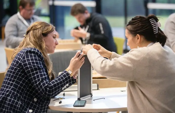 2 women assemble a solar powered kit
